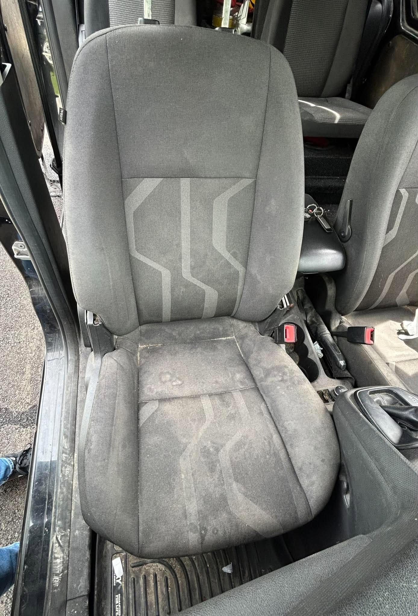 Front seat before Xclusive interior detailing Stained cloth truck seat before interior detailing
